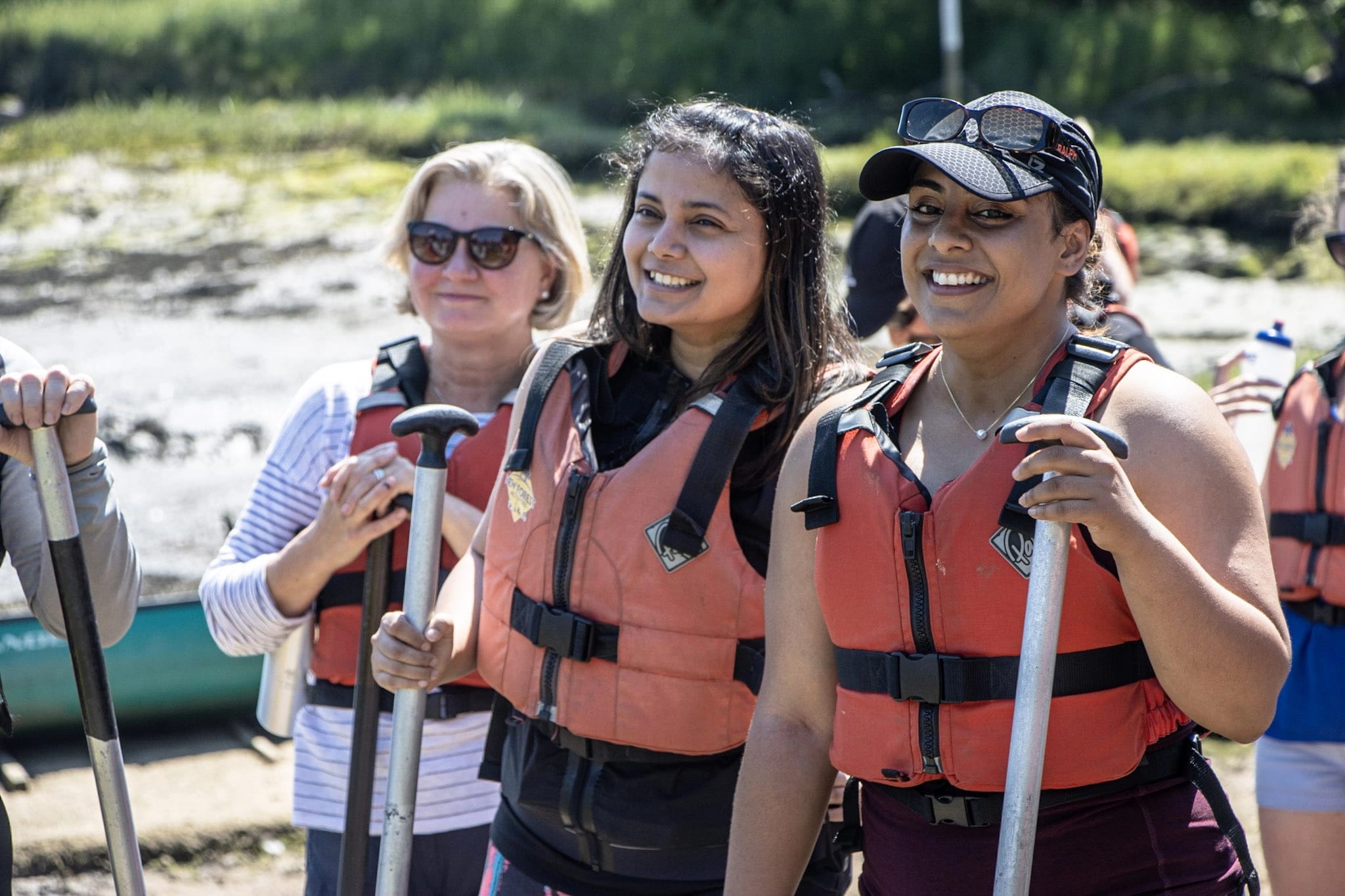 two friends ready to paddle after looking for fun activities for adults in The New Forest.